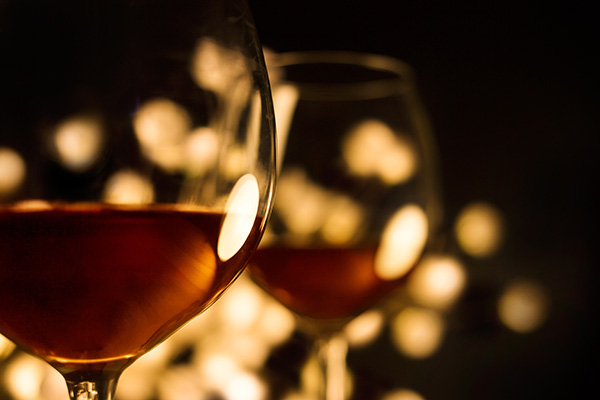 Glasses of wine in candle light